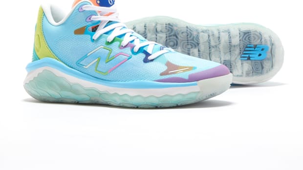 View of blue and white New Balance shoes.